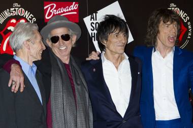 Charlie Watts, Keith Richards, Ronnie Wood and Mick Jagger of The Rolling Stones arrive at a central London venue Thursday, July 12, 2012, to mark the 50th anniversary of The Rolling Stones’ first performance.