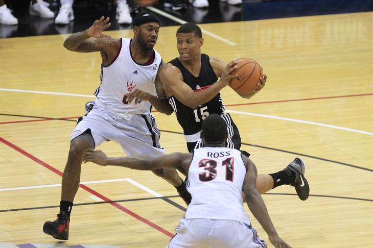 Houston Rockets guard Scott Machado is guarded by Toronto Raptors guard Bobby Brown during their NBA Summer League game Friday, July 13, 2012.