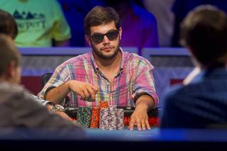 Robert Salaburu, a poker player from San Antonio Texas, competes in the World Series of Poker $10,000 buy-in, no-limit Texas Hold'em main event at the Rio Monday, July 16, 2012