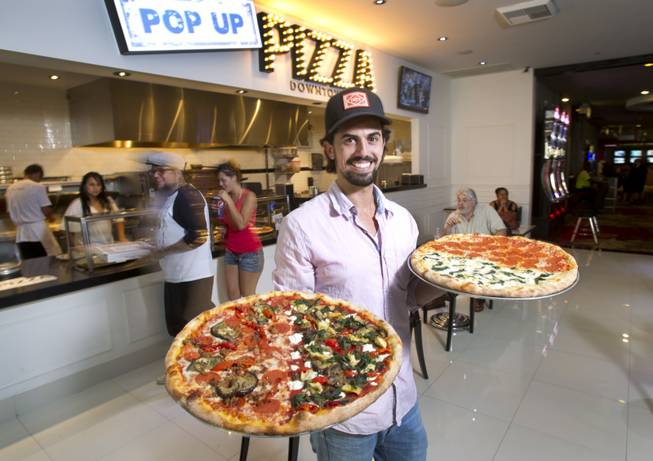 Michael Vakneen poses with pizza at Pop Up Pizza in ...