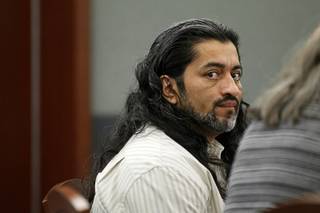 Jaime Garcia-Cruz, who was arrested under the alias of Victor Cruz-Garcia, appears in court during his sentencing hearing at the Regional Justice Center on Monday, July 23, 2012. Garcia-Cruz was convicted of killing Beatrice Alvarez, 46, and attacking her children with a machete in 2007.