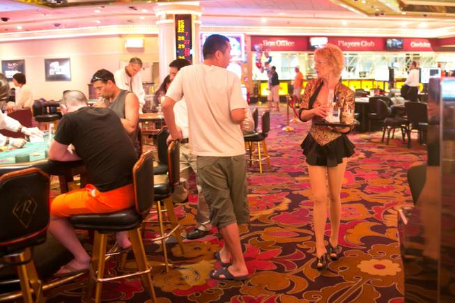 Karen Crawford, a cocktail waitress who's worked at the Riviera since 1977, makes the rounds on the casino floor, July 23, 2012.