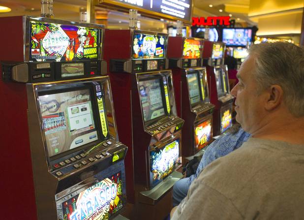 Slot players watch a virtual horse race on their machines at the South Point Thursday, July 26, 2012. The South Point is the first casino in Nevada to implement the Virtual Race by Bally Technologies. There are four races every Thursday and slot players qualify for the races by obtaining 25 points, playing with their club card, within two hours of each race. Winners split a total prize pool of $30,000 in bonus credits.
