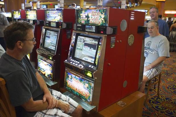 Slot players watch a virtual horse race on their machines at the South Point Thursday, July 26, 2012. The South Point is the first casino in Nevada to implement the Virtual Race by Bally Technologies. There are four races every Thursday and slot players qualify for the races by obtaining 25 points, playing with their club card, within two hours of each race. Winners split a total prize pool of $30,000 in bonus credits.