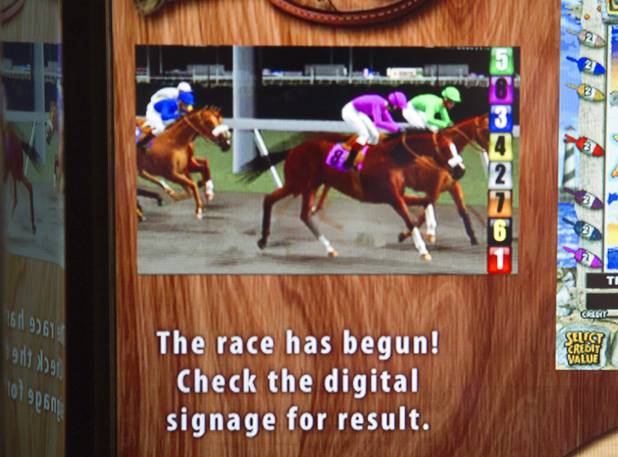 A virtual horse race is displayed on a slot machine at the South Point Thursday, July 26, 2012. The South Point is the first casino in Nevada to implement the Virtual Race by Bally Technologies. There are four races every Thursday and slot players qualify for the races by obtaining 25 points, playing with their club card, within two hours of each race. Winners split a total prize pool of $30,000 in bonus credits.