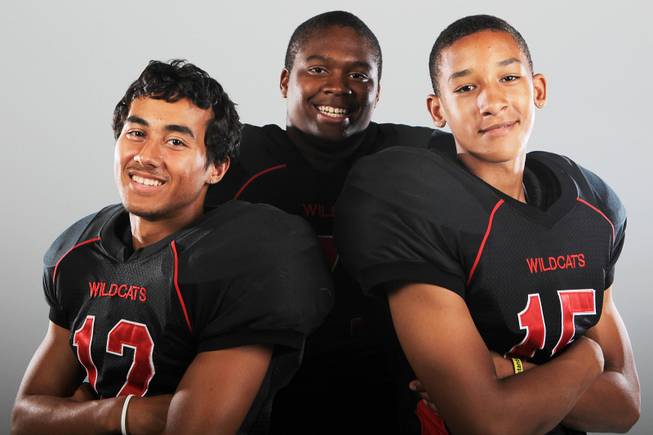 Las Vegas football players Vince Castro, Lahmed Evans and Joshua Mayfield Thursday, July 26, 2012.