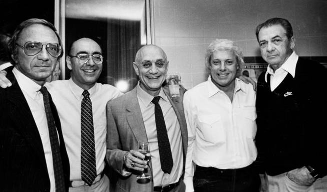 UNLV basketball coach Jerry Tarkanian is seen with, from left, ...