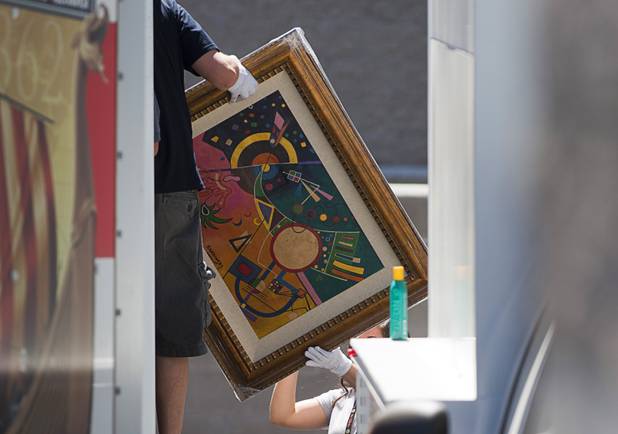 Artwork by Russian painter Wassily Kandinsky is loaded onto a truck during a seizure in Boulder City, Nevada, about 20 miles southeast of Las Vegas, July 27, 2012. The seizure is apparently related to the arrest of German fugitive Ulrich Felix Anton Engler, 51, who was arrested in the Las Vegas area on July 25. Engler is accused of bilking investors of over $100 million using an Internet pyramid scheme.