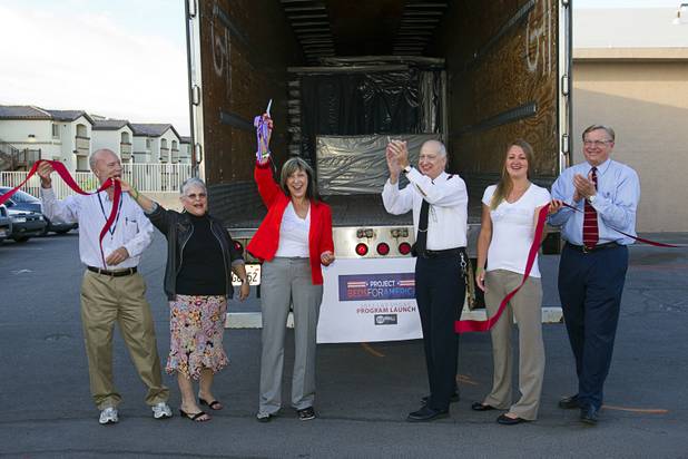 Members of the Salvation Army and executives from WorldBed celebrate a donation of 200 new mattresses at the Salvation Army shelter on Owens Avenue Monday, July 30, 2012. From left: Thomas Bell, Leslie Rogers, Laura Castro, Robert Lloyd, Reanne Miller and David Robeck. The donation was the launch of Project Beds for America by WorldBed. 