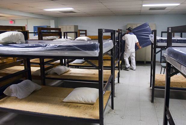 A volunteer carries a mattress during a donation of 200 new mattresses at the Salvation Army Shelter on Owens Avenue Monday, July 30, 2012. The donation was the launch of Project Beds for America by World Bed. WorldBed, working with government and local charities, hopes to donate 2,000 anti-bacterial, bug-proof and water-proof mattresses to shelters around the Las Vegas Valley.