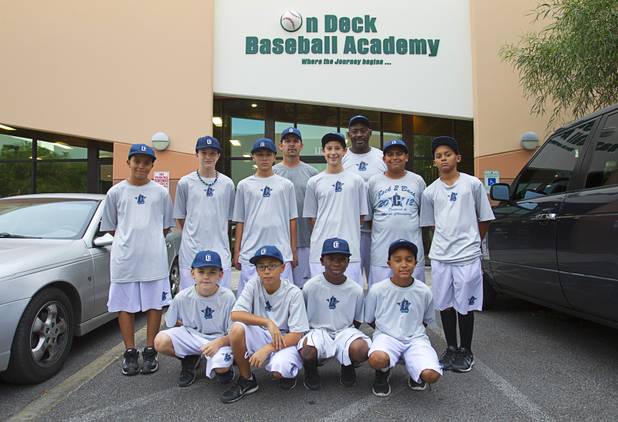 Members of the Cheyenne Little League's 11-12 yr. old Majors division pose at the On Deck Baseball Academy Tuesday, July 31, 2012. Front row, from left are: Cade Printy, Chayse Baker, DeAngelo Smith, Mitchell Otis. Back row, from left are: Trevor Berkemeyer, Gabriel Kline, Layton Walls, Jesse Fonteboa, Jimmy Gamboa, and Edarian Williams. Also pictures are coaches Mike Printy, left, and Derrick Williams. Not pictured are Freddie Tucker, Abraham Duran, Rick Guzman and Ryan Merino.