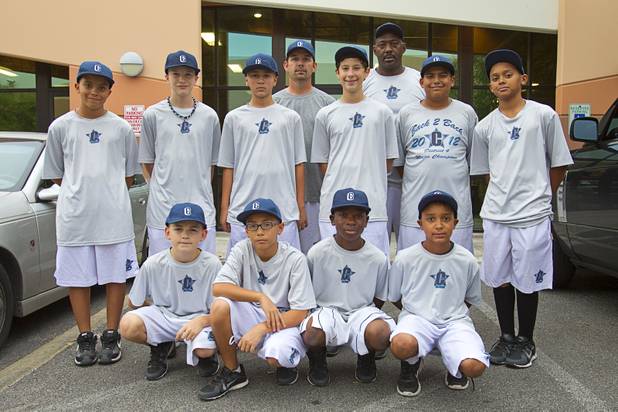 Members of the Cheyenne Little League's 11-12 yr. old Majors division pose at the On Deck Baseball Academy Tuesday, July 31, 2012. Front row, from left are: Cade Printy, Chayse Baker, DeAngelo Smith, Mitchell Otis. Back row, from left are: Trevor Berkemeyer, Gabriel Kline, Layton Walls, Jesse Fonteboa, Jimmy Gamboa, and Edarian Williams. Also pictures are coaches Mike Printy, left, and Derrick Williams. Not pictured are Freddie Tucker, Abraham Duran, Rick Guzman and Ryan Merino.