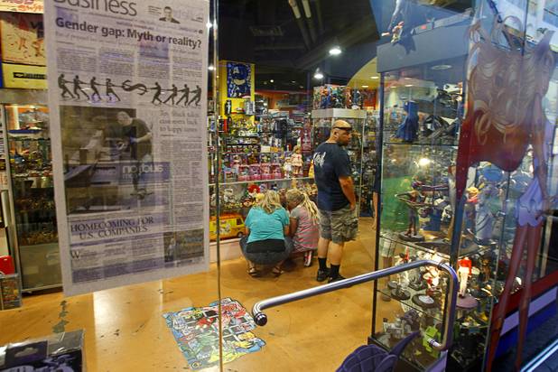Customers browse at the Toy Shack at the Neonopolis mall in downtown Las Vegas Wednesday, August 1, 2012.