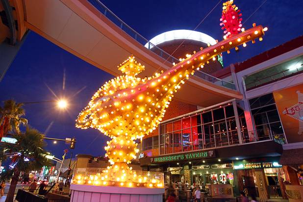 Aladdin's Lamp is illuminated in front of the Neonopolis mall in downtown Las Vegas Wednesday, August 1, 2012.  The lamp was originally installed at the Aladdin Hotel in 1966.