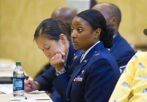 First Lt. Alexandria Randall, center, of Andrews AFB listens to a panel discussion during the International Black Aerospace Council convention at the Las Vegas Hotel Wednesday, August 1, 2012.