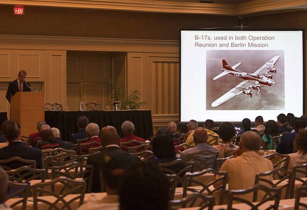A B-17 Fling Fortress is shown during a presentation of Tuskegee Airmen missions the International Black Aerospace Council convention at the Las Vegas Hotel Wednesday, August 1, 2012.  Historian Daniel Haulman, left, gave details of two Tuskegee bomber escort missions - one over Berlin and another to rescue POWs in Romania.