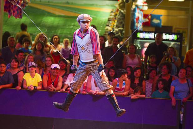 Slack wire artist Evgeny Vasilenko of Russia performs at the Midway at Circus Circus Thursday, August 2, 2012.