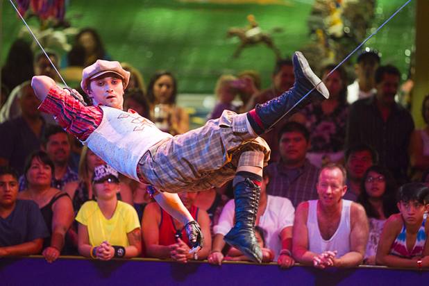 Slack wire artist Evgeny Vasilenko of Russia performs at the Midway at Circus Circus Thursday, August 2, 2012.