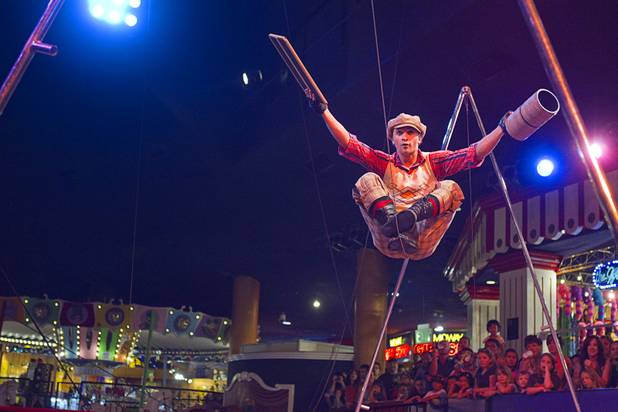 Slack wire artist Evgeny Vasilenko of Russia performs at the Midway at Circus Circus Thursday, August 2, 2012.