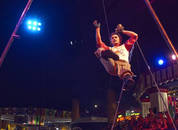 Slack wire artist Evgeny Vasilenko of Russia performs at the Midway at Circus Circus Thursday, August 2, 2012.