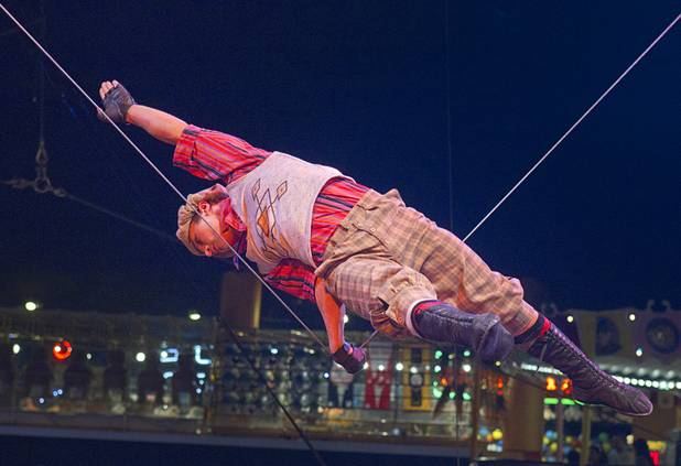 Slack wire artist Evgeny Vasilenko of Russia performs at the Midway at Circus Circus Thursday, August 2, 2012.