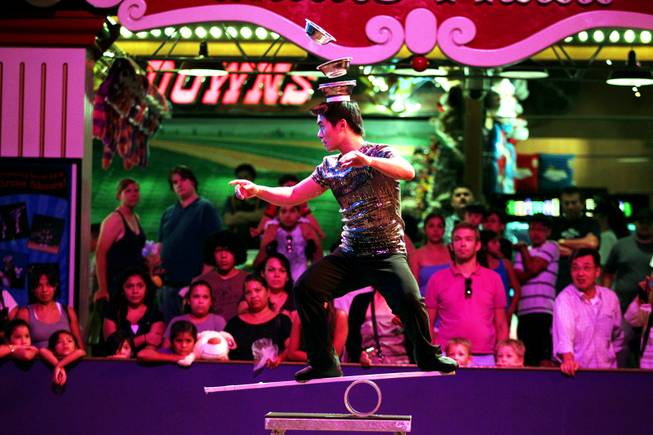 Jason Xiao performs on the Rolla Bola at the Circus Circus Midway in Las Vegas on Thursday, August 2, 2012.
