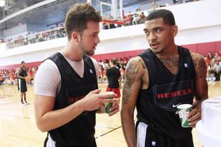 UNLV guards Katin Reinhardt and Anthony Marshall talk during their open practice Saturday, August 4, 2012.