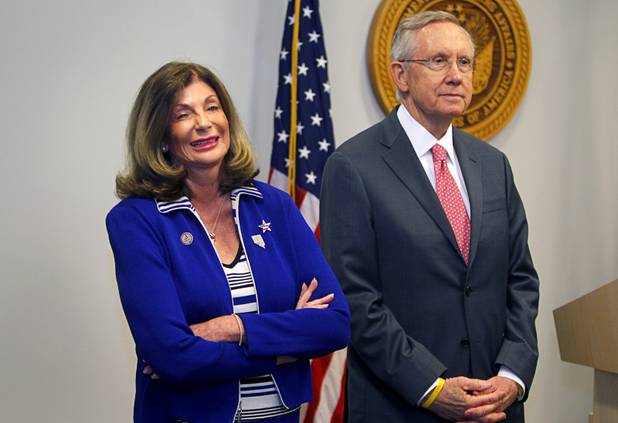 Congresswoman Shelley Berkley stands by Senate Majority Leader Harry Reid as they wait to take questions from reporters following a dedication ceremony for the VA Southern Nevada Healthcare System Las Vegas Medical Center (VASNHS) in North Las Vegas Monday, August 6, 2012.