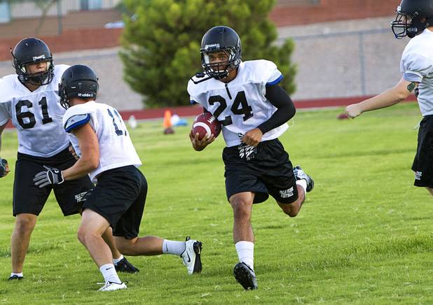 Palo Verde High School's Ryan Beaulieu carries the ball during practice at the school Tuesday, Aug. 7, 2012. Palo Verde will face Desert Vista High School (Arizona) in the Sollenberger Classic at the University of Phoenix Stadium in Arizona on Aug. 18.