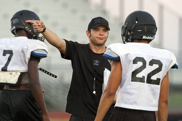 Palo Verde High School defensive line coach Devin Penny gives instruction to players during practice at the school Tuesday, Aug. 7, 2012. Palo Verde will face Desert Vista High School (Arizona) in the Sollenberger Classic at the University of Phoenix Stadium in Arizona on Aug. 18.