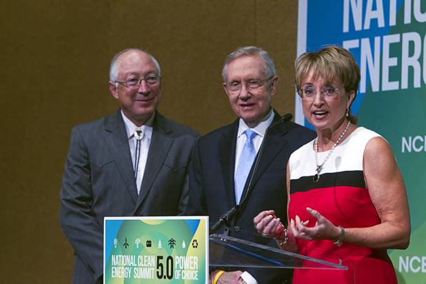 Denise Bode, CEO of the American Wind Energy, speaks as U.S. Secretary of the Interior Ken Salazar, left, and Senate Majority leader Harry Reid look on during a news conference at the National Clean Energy Summit 5.0 at the Bellagio Tuesday, August 7, 2012. Officials announced that American wind power has reached a 50-gigawatt milestone, in part due to the Spring Valley wind farm near Ely, Nevada.