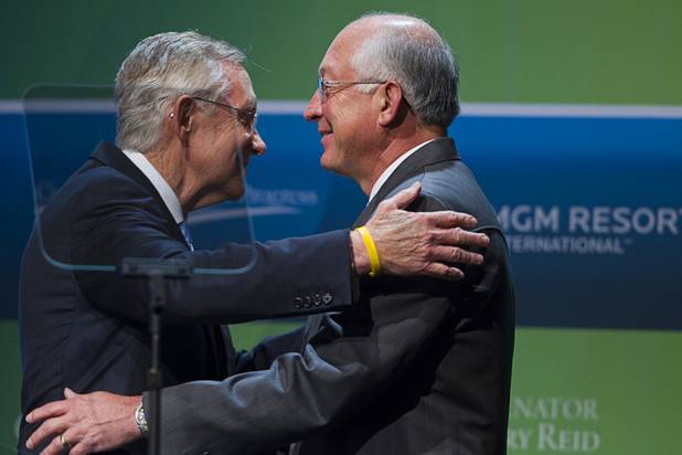 Senate Majority leader Harry Reid, left, gives a hug to U.S. Secretary of the Interior Ken Salazar after introducing him for a keynote address during the National Clean Energy Summit 5.0 at the Bellagio Tuesday, August 7, 2012.