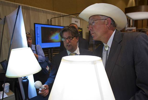 U.S. Secretary of the Interior Ken Salazar, right, and inventor Dan Lang look over lamps with BrightSol LED bulbs during the National Clean Energy Summit 5.0 at the Bellagio Tuesday, August 7, 2012. The DLite bulbs gives off the same amount of light as a 60 watt incandescent bulb but use only 9.5 watts and have an expected lifetime of 1 million hours. The bulbs should be available in stores by the end of the year and cost less than $15.00.