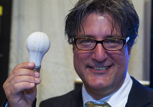 Inventor Dan Lang holds a BrightSol DLite LED bulb during the National Clean Energy Summit 5.0 at the Bellagio Tuesday, August 7, 2012. The DLite bulbs gives off the same amount of light as a 60 watt incandescent bulb but use only 9.5 watts and have an expected lifetime of 1 million hours. The bulbs should be available in stores by the end of the year and cost less than $15.00.