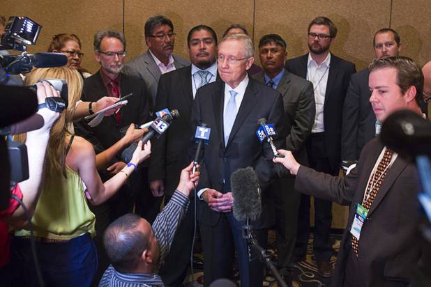 Senate Majority Leader Harry Reid is joined by members of the Moapa band of Paiutes and environmentalists as he calls for the closing of NV Energy's Reid Gardner coal-fired power plant during the National Clean Energy Summit 5.0 at the Bellagio Tuesday, August 7, 2012.