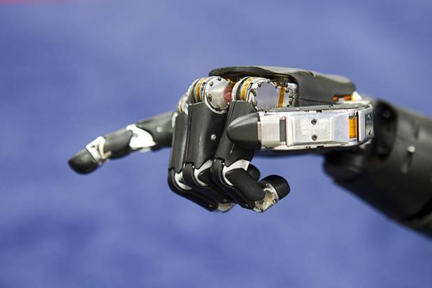 A robotic hand is shown at the Johns Hopkins University Applied Physics Laboratory booth during the Association for Unmanned Vehicles Systems International (AUVSI) convention at the Mandalay Bay Thursday, Aug. 9, 2012.