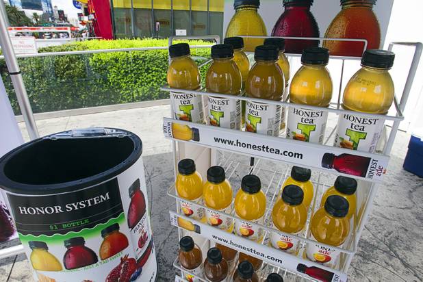 Bottles of Honest Tea are displayed at a self-service Honest Tea kiosk on the Las Vegas Strip Monday, Aug. 13, 2012. Observers from the tea company watched from a distance and recorded how many people paid for the tea and how many did not. The Honest Cities social experiment is being held in 50 locations in 30 cities.