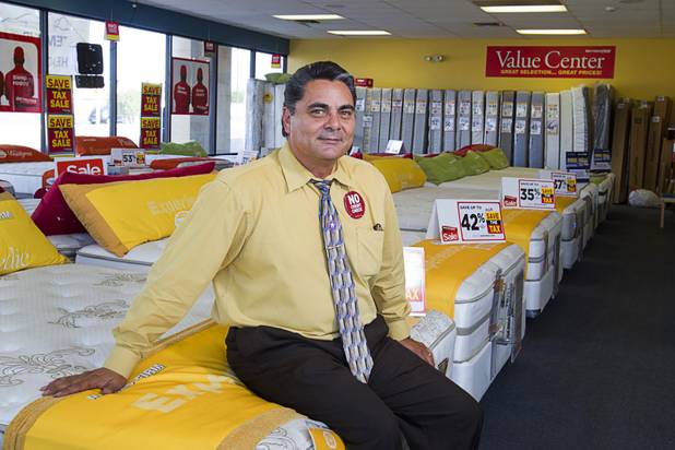 Julian "Jay" Carrasco poses in the Mattress Firm store at 3375 E. Tropicana Ave. Monday, Aug. 13, 2012.  Formerly in construction, Carrasco has received Las Vegas Chamber of Commerce awards for customer service in 2011 and 2012 and sells so many power base beds that he earned the nickname "Power Play Jay."