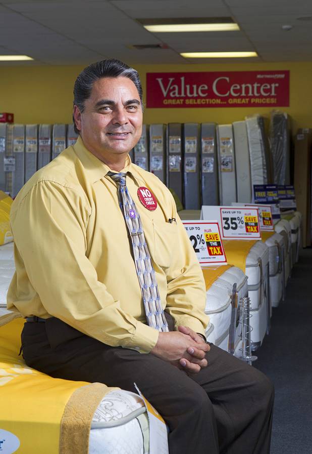 Julian "Jay" Carrasco poses in the Mattress Firm store at 3375 E. Tropicana Ave. Monday, Aug. 13, 2012.  Formerly in construction, Carrasco has received Las Vegas Chamber of Commerce awards for customer service in 2011 and 2012 and sells so many power base beds that he earned the nickname "Power Play Jay."