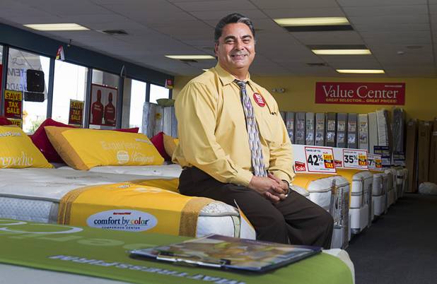 Julian "Jay" Carrasco poses in the Mattress Firm store at 3375 E. Tropicana Ave. Monday, Aug. 13, 2012.  Formerly in construction, Carrasco has received Las Vegas Chamber of Commerce awards for customer service in 2011 and 2012 and sells so many power base beds that he earned the nickname "Power Play Jay."