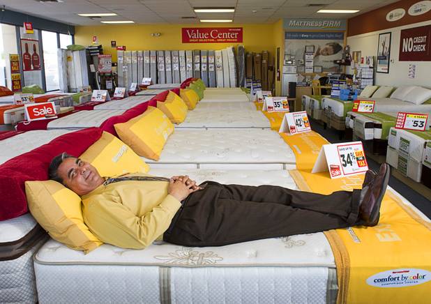 Julian "Jay" Carrasco poses in the Mattress Firm store at 3375 E. Tropicana Ave. Monday, Aug. 13, 2012.  Formerly in construction, Carrasco has received Las Vegas Chamber of Commerce awards for customer service in 2011 and 2012 and sells so many power base beds that he earned the nickname "Power Play Jay."