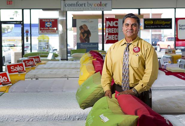 Julian "Jay" Carrasco poses in the Mattress Firm store at 3375 E. Tropicana Ave. Monday, Aug. 13, 2012.  Formerly in construction, Carrasco has received Las Vegas Chamber of Commerce awards for customer service in 2011 and 2012 and sells so many power base beds that he earned the nickname "Power Play Jay."