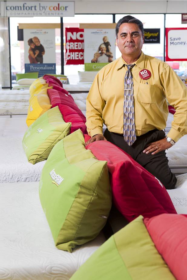 Julian "Jay" Carrasco poses in the Mattress Firm store at 3375 E. Tropicana Ave. Monday, Aug. 13, 2012.  Formerly in construction, Carrasco has received Las Vegas Chamber of Commerce awards for customer service in 2011 and 2012 and sells so many power base beds that he earned the nickname "Power Play Jay."
