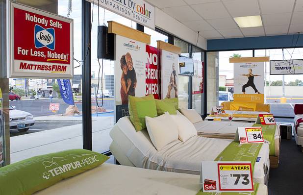 A bed with a power base, center, is shown in the Mattress Firm store at 3375 E. Tropicana Ave. Monday, Aug. 13, 2012.  Formerly in construction, Julian "Jay" Carrasco has received Las Vegas Chamber of Commerce awards for customer service in 2011 and 2012 and sells so many power base beds that he earned the nickname "Power Play Jay."