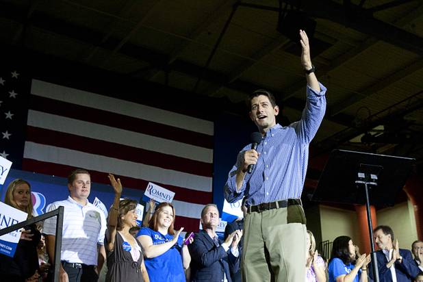 Republican vice presidential candidate Paul Ryan waves to supporters after taking the stage for a rally at Palo Verde High School in Summerlin Tuesday, Aug. 14, 2012.