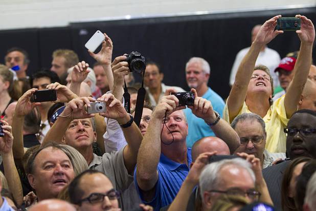 Supporters try to get photos of Republican vice presidential candidate Paul Ryan during a rally at Palo Verde High School in Summerlin Tuesday, Aug. 14, 2012.