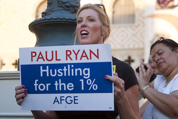 Bridget Martin, political director for the International Brotherhood of Boilermakers, pickets against Republican vice presidential candidate Paul Ryan in front of the Venetian on the Las Vegas Strip Tuesday, Aug. 14, 2012. Ryan was reportedly meeting privately with a small group of supporters at the casino owned by Sheldon Adelson, a billionaire and major donor to Republican campaigns.