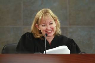 Judge Linda Bell smiles during a status check as she presides over specialty court Tuesday, August 14, 2012.