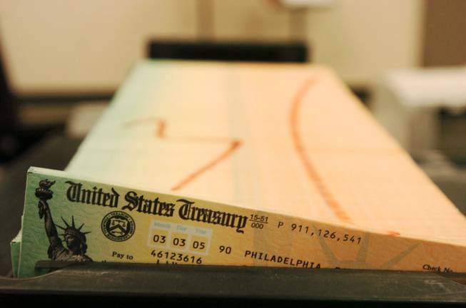Trays of printed Social Security checks wait to be mailed in February 2005 from the U.S. Treasury's Financial Management services facility in Philadelphia.