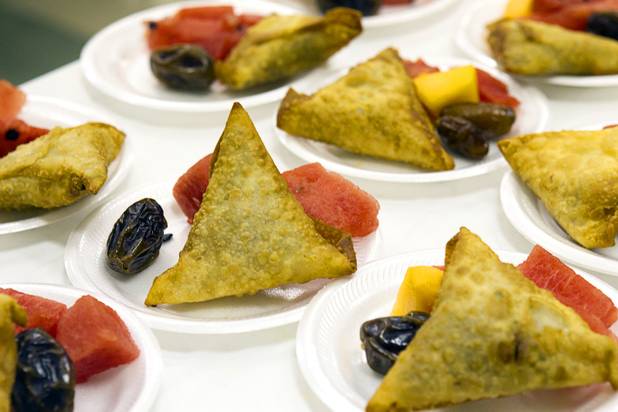 Samosa and fruit are laid out on the 27th day of Ramadan at the Jamia Masjid mosque Wednesday, Aug. 15, 2012. During the month of Ramadan, Muslims fast from dawn until sunset.